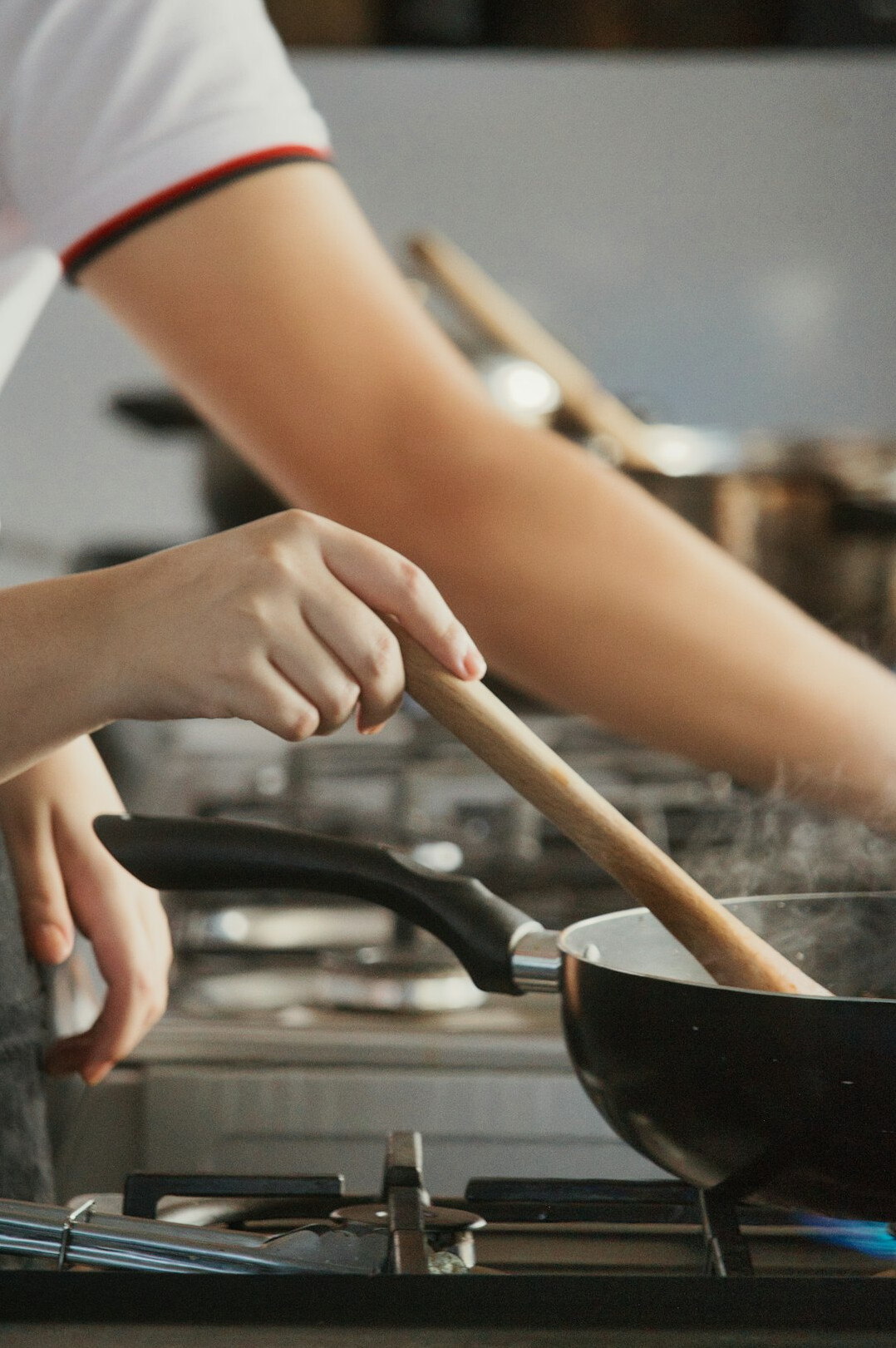 person cooking in kitchen